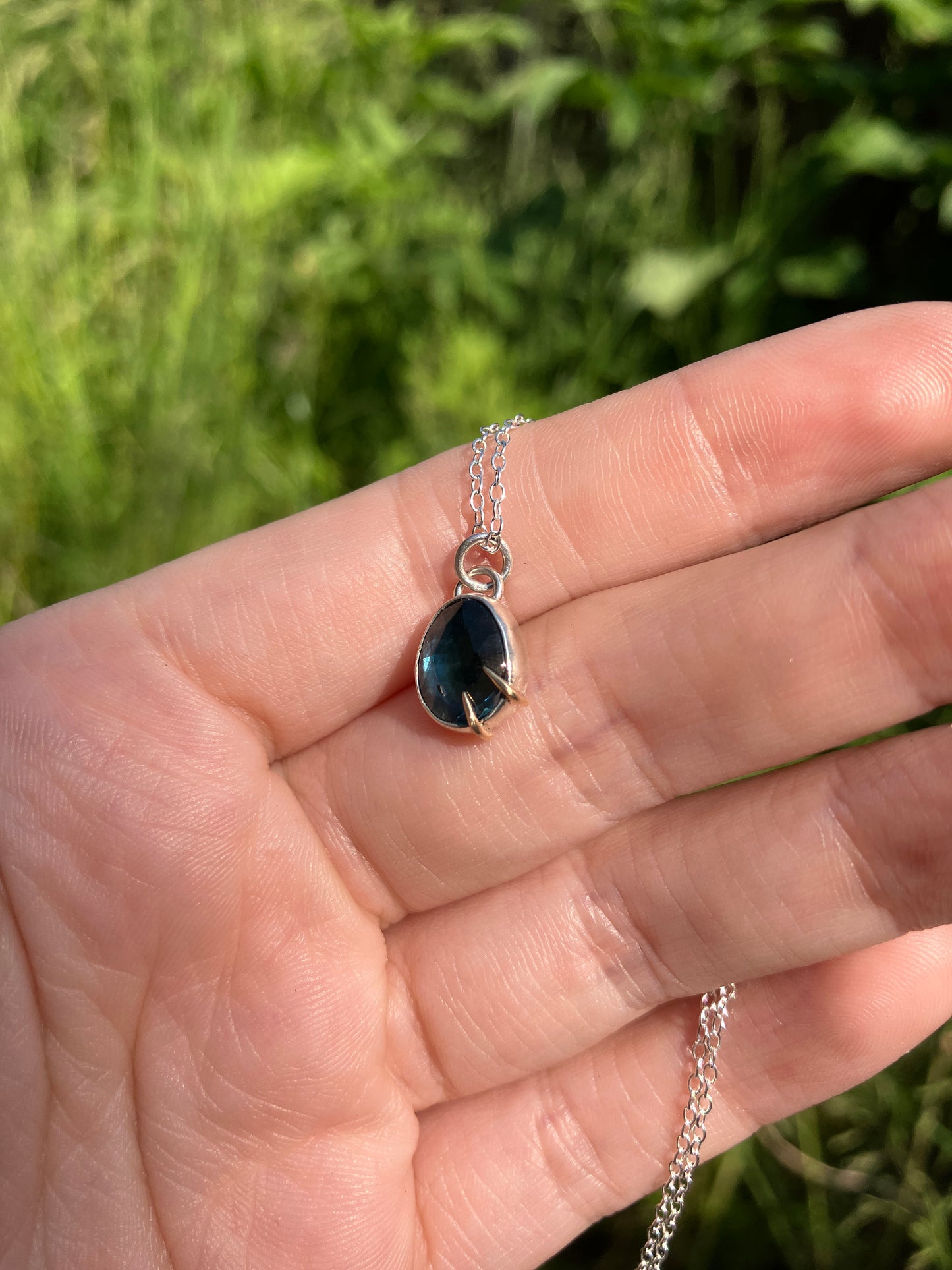 London Blue Topaz and Sterling Silver Pendant Necklace with 9ct Gold Claw Detail on Sterling Silver Chain