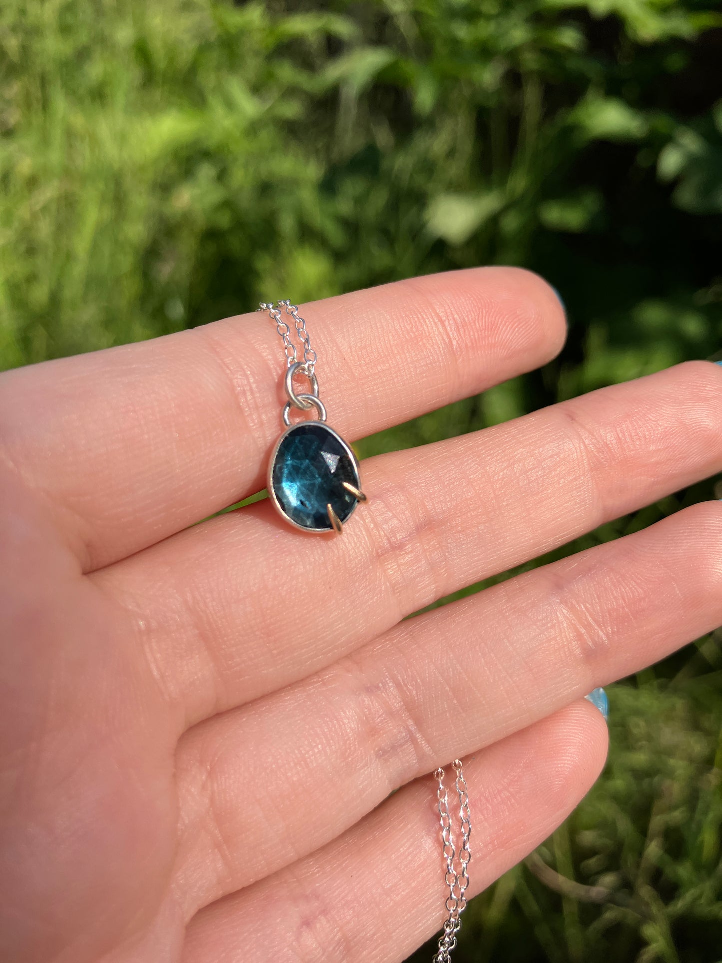 London Blue Topaz and Sterling Silver Pendant Necklace with 9ct Gold Claw Detail on Sterling Silver Chain