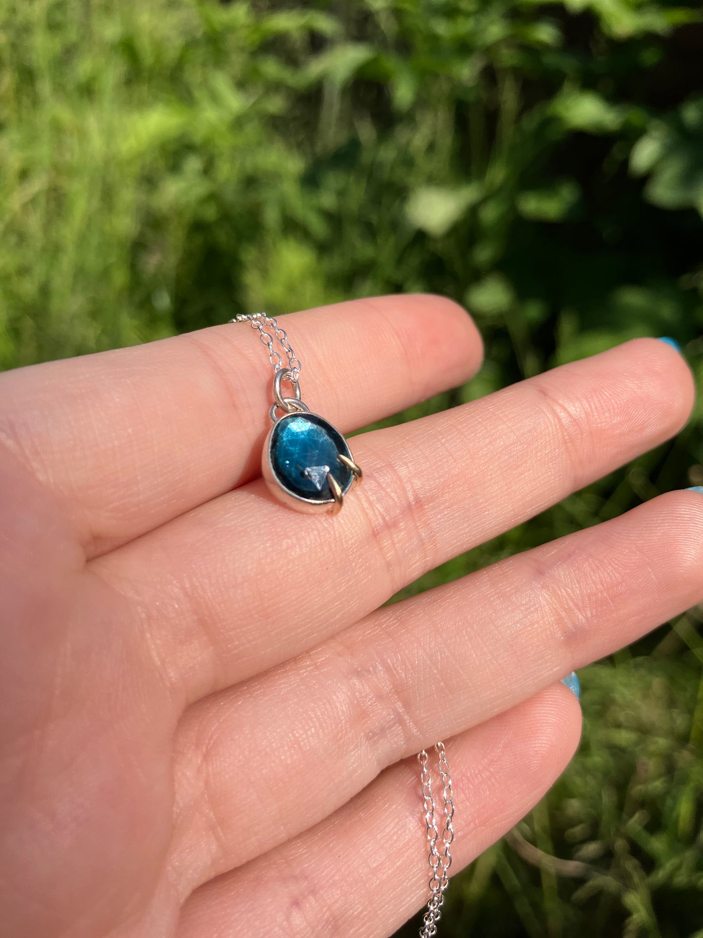 London Blue Topaz and Sterling Silver Pendant Necklace with 9ct Gold Claw Detail on Sterling Silver Chain