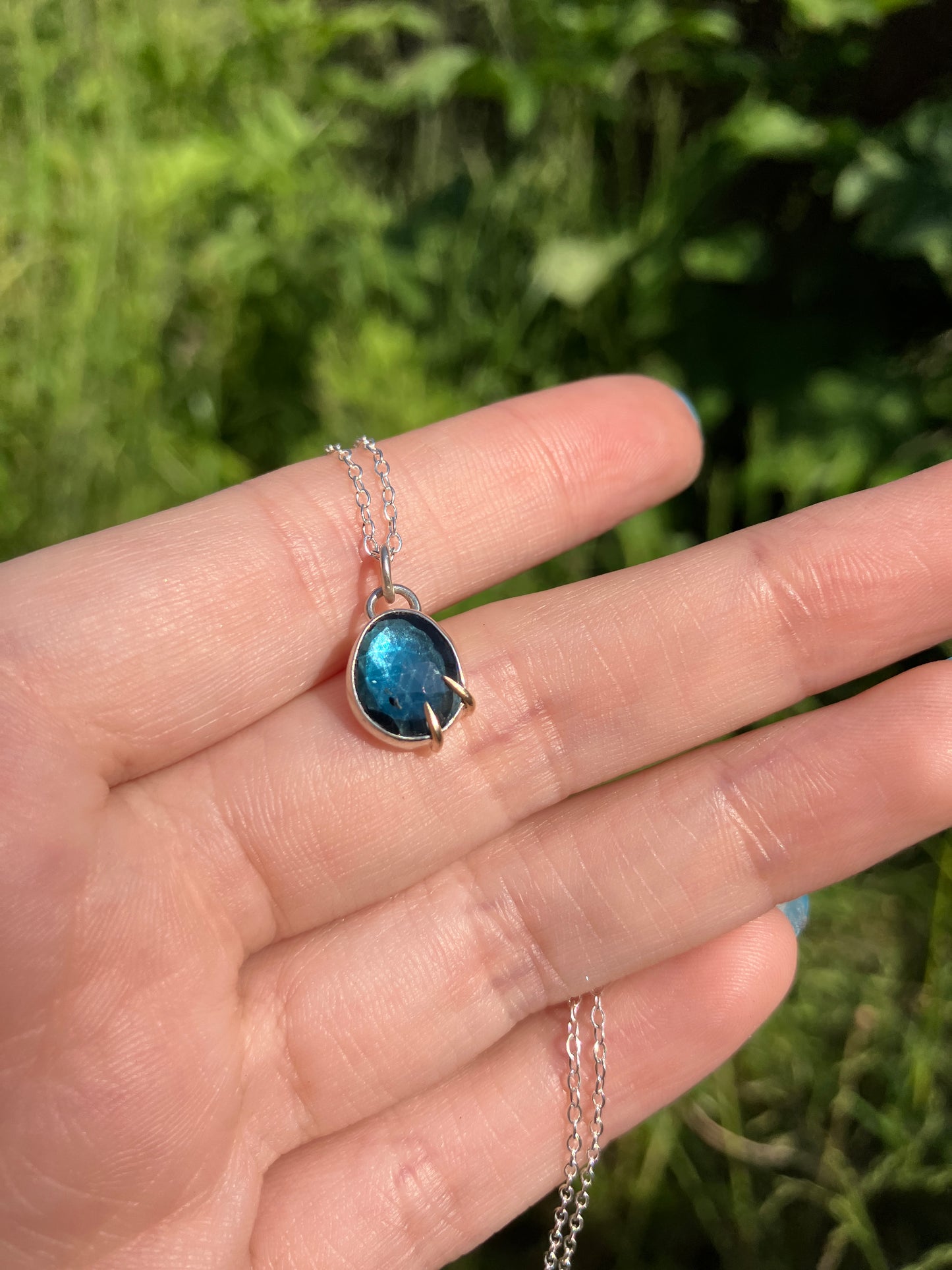 London Blue Topaz and Sterling Silver Pendant Necklace with 9ct Gold Claw Detail on Sterling Silver Chain