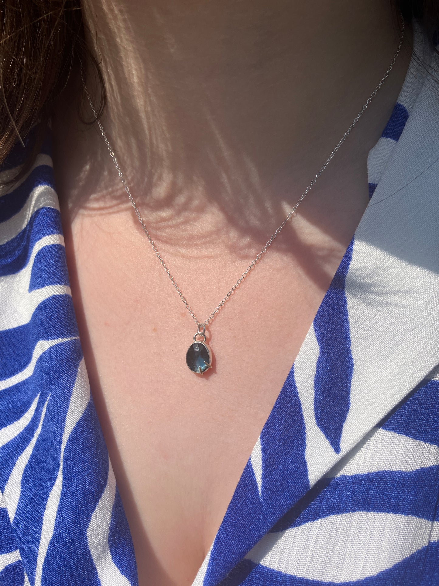 London Blue Topaz and Sterling Silver Pendant Necklace with 9ct Gold Claw Detail on Sterling Silver Chain