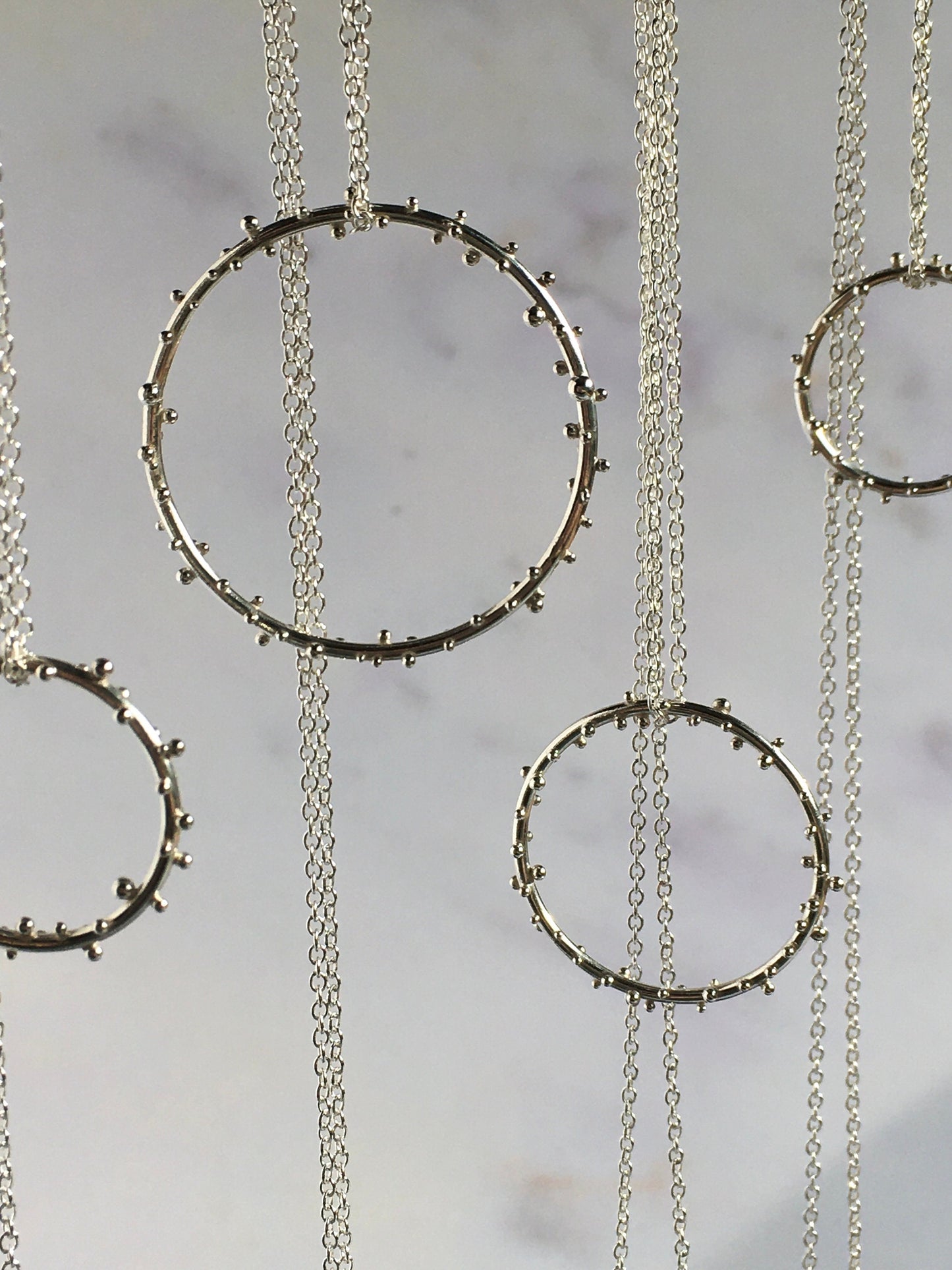 Sterling Silver Iota Circle Necklaces with Granulation in Varying Sizes